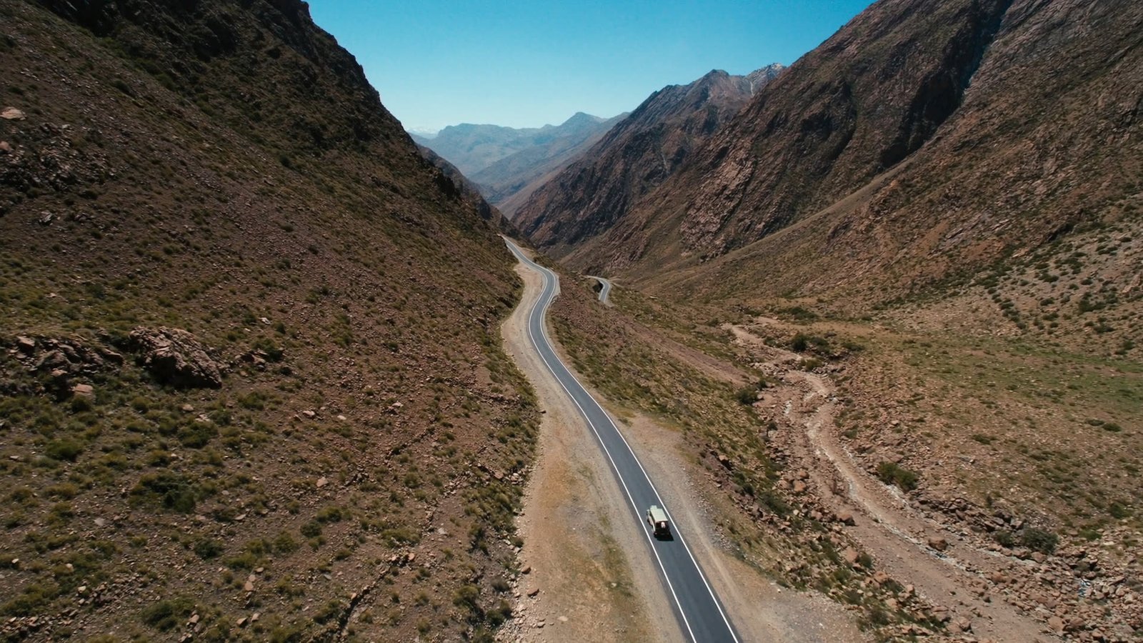 A 4x4 on the winding Tizi n'Tichka pass road through the High Atlas mountains